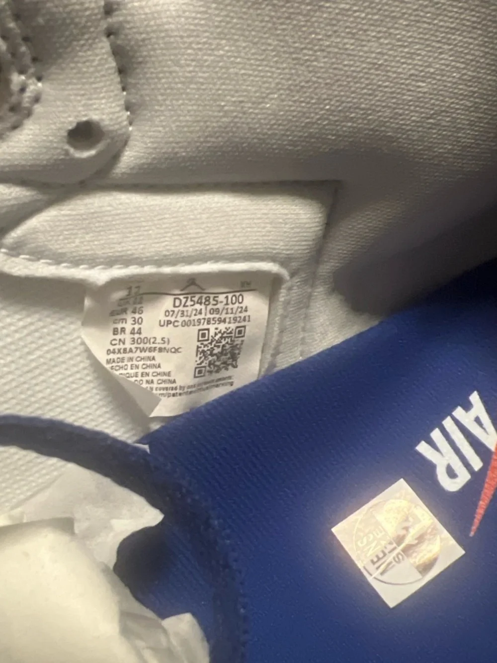 Nike Men’s White and Navy High-Top Sneakers with Black Swoosh